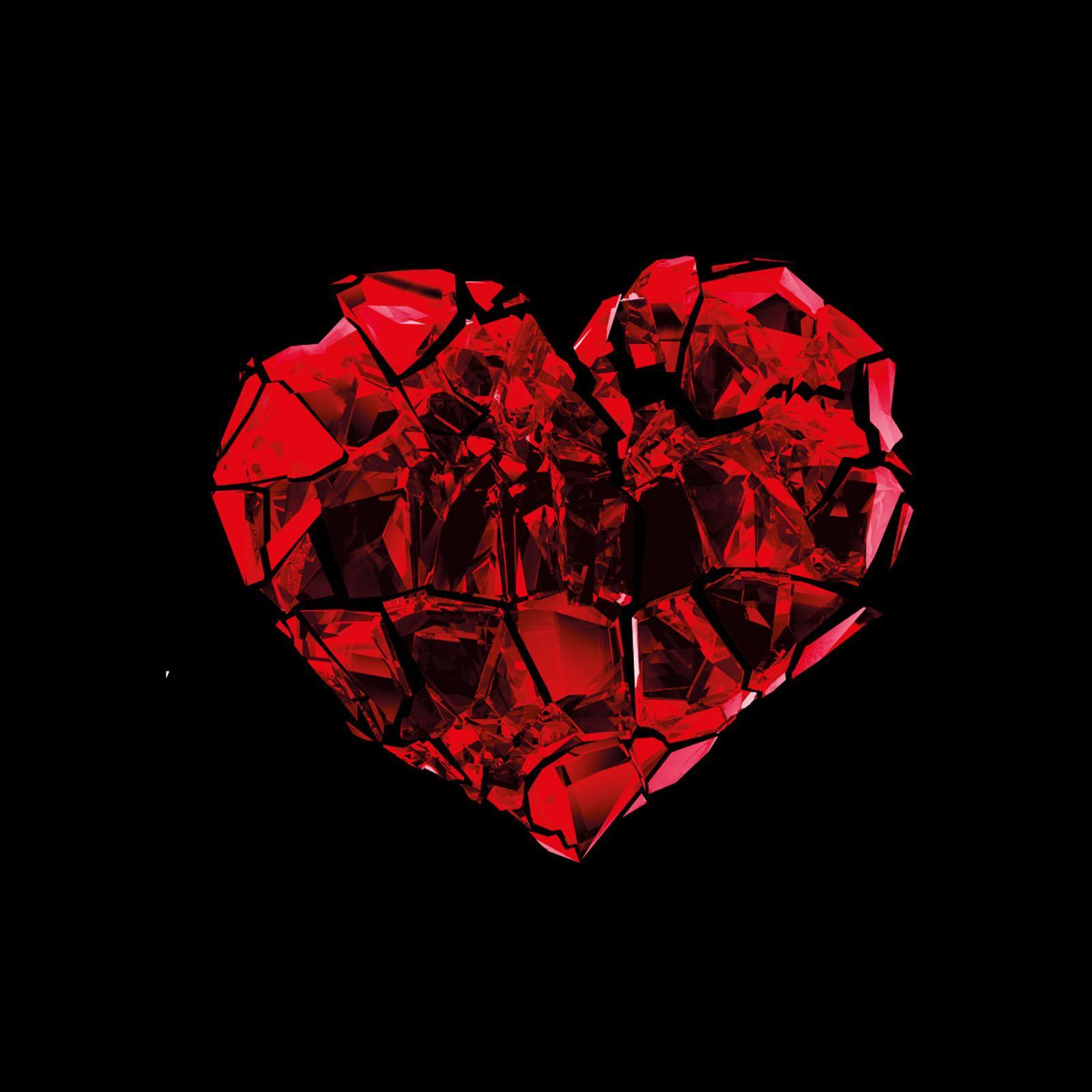 A crystallised red heart against a black background 